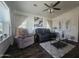 Stylish living room featuring dark wood floors, modern furniture, and a large window for natural light at 650 N Hawes Rd # 3123, Mesa, AZ 85207