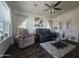 Comfortable living room with modern furniture and a ceiling fan at 650 N Hawes Rd # 3123, Mesa, AZ 85207