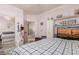Comfortable bedroom featuring a bed, TV, closet, and access to an attached bathroom at 7103 E Medina Ave, Mesa, AZ 85209
