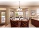 Bright dining room features natural light from windows and a door to the backyard at 7103 E Medina Ave, Mesa, AZ 85209