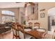 Spacious dining area open to the living room and featuring a wooden dining set at 7103 E Medina Ave, Mesa, AZ 85209