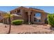Charming two-story home featuring a well-maintained yard and neutral-toned exterior at 7103 E Medina Ave, Mesa, AZ 85209