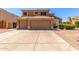 Charming two-story home with a three-car garage and well-maintained landscaping at 7103 E Medina Ave, Mesa, AZ 85209
