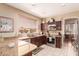 Well-lit kitchen with granite countertops, stainless steel appliances, and tiled backsplash at 7103 E Medina Ave, Mesa, AZ 85209