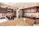 Gourmet kitchen featuring granite counters, stainless appliances, and ample storage space at 7103 E Medina Ave, Mesa, AZ 85209