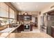 Bright kitchen with granite counters, stainless appliances, and convenient breakfast nook at 7103 E Medina Ave, Mesa, AZ 85209