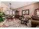 Inviting living room featuring elegant furnishings, a ceiling fan, and neutral decor at 7103 E Medina Ave, Mesa, AZ 85209