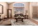 Bright living room featuring a large window and elegant furnishings at 7103 E Medina Ave, Mesa, AZ 85209