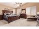 Luxurious main bedroom with vaulted ceiling, ceiling fan, and a sitting area at 7103 E Medina Ave, Mesa, AZ 85209