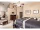 Spacious main bedroom boasts a ceiling fan, and includes an ensuite bathroom with soaking tub at 7103 E Medina Ave, Mesa, AZ 85209