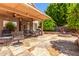 Comfortable covered patio includes ceiling fans, a built-in BBQ, and ample seating for outdoor dining at 7103 E Medina Ave, Mesa, AZ 85209
