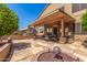 Spacious covered patio featuring ceiling fans and a built-in BBQ area perfect for outdoor entertaining at 7103 E Medina Ave, Mesa, AZ 85209
