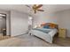 Inviting bedroom featuring a ceiling fan, neutral decor, and an en-suite bathroom at 7129 E Broadway Rd # 72, Mesa, AZ 85208