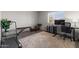 Versatile room featuring exercise equipment, desk space, and natural light from the window at 7129 E Broadway Rd # 72, Mesa, AZ 85208