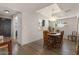 Charming dining room with wood floors, a round table, and stylish lighting fixture at 7129 E Broadway Rd # 72, Mesa, AZ 85208