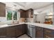 Modern kitchen with stainless steel appliances, quartz countertops, and a breakfast bar at 7129 E Broadway Rd # 72, Mesa, AZ 85208