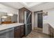 Open kitchen with stainless steel appliances and view into dining area at 7129 E Broadway Rd # 72, Mesa, AZ 85208