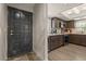 Kitchen with dark cabinets and stainless steel appliances next to front door at 7129 E Broadway Rd # 72, Mesa, AZ 85208