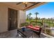 Relaxing outdoor patio with comfortable seating and scenic golf course views at 7129 E Broadway Rd # 72, Mesa, AZ 85208