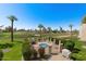 Community pool and hot tub surrounded by lush landscaping and golf course views at 7129 E Broadway Rd # 72, Mesa, AZ 85208