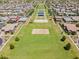 Aerial view of the community park, showcasing its green spaces, walking paths, and recreational amenities at 7149 E Plata Ave, Mesa, AZ 85212