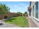 Spacious grassy backyard with block wall, landscaping and patio at 7149 E Plata Ave, Mesa, AZ 85212
