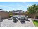 Patio with comfortable seating and greenery in fenced backyard at 7149 E Plata Ave, Mesa, AZ 85212