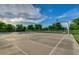 Community basketball court surrounded by lush greenery and trees, offering a great place for recreation at 7149 E Plata Ave, Mesa, AZ 85212