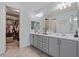 Bathroom featuring double vanity sinks and walk-in closet at 7149 E Plata Ave, Mesa, AZ 85212