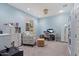 Bedroom area with seating, desk and storage, with neutral toned walls and carpeting at 7149 E Plata Ave, Mesa, AZ 85212