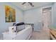 Bright bedroom featuring modern ceiling fan, artwork, and white desk at 7149 E Plata Ave, Mesa, AZ 85212