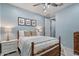 Bedroom featuring bright blue walls with en suite bathroom and walk-in closet at 7149 E Plata Ave, Mesa, AZ 85212
