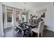 The dining room features a dining table and bench seating under a modern light fixture at 7149 E Plata Ave, Mesa, AZ 85212