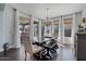 Bright dining room with dark floors and modern light fixture at 7149 E Plata Ave, Mesa, AZ 85212