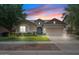 Charming single-story home with a well-manicured lawn and a two-car garage, showcasing inviting curb appeal at 7149 E Plata Ave, Mesa, AZ 85212