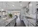 Open kitchen with granite countertops, stainless steel appliances, and pendant lighting over the island at 7149 E Plata Ave, Mesa, AZ 85212
