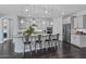 Spacious kitchen featuring an island with bar seating, stainless steel appliances, and ample counter space at 7149 E Plata Ave, Mesa, AZ 85212