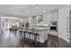 Well-lit kitchen with stainless steel appliances, a large island, and a view into the dining area at 7149 E Plata Ave, Mesa, AZ 85212