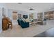Spacious living room with a ceiling fan, lots of light and plush seating at 7149 E Plata Ave, Mesa, AZ 85212