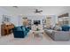 Bright living room with comfortable seating, ceiling fan, and stylish decor at 7149 E Plata Ave, Mesa, AZ 85212
