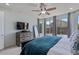 Comfortable main bedroom with en-suite bathroom, ceiling fan, and lots of natural light at 7149 E Plata Ave, Mesa, AZ 85212