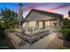 Back patio with outdoor seating and manicured landscaping at 7149 E Plata Ave, Mesa, AZ 85212