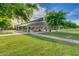 Shaded picnic area in the park with picnic tables and a grassy area, perfect for outdoor gatherings at 7149 E Plata Ave, Mesa, AZ 85212