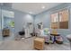 Brightly lit sitting room featuring ample space, a sitting chair, and an ottoman at 7149 E Plata Ave, Mesa, AZ 85212
