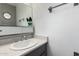 Compact bathroom featuring a simple mirror and a sink with a chrome faucet at 7506 N 47Th Dr, Glendale, AZ 85301