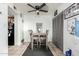 Dining area featuring neutral table and chairs set and a modern ceiling fan at 7506 N 47Th Dr, Glendale, AZ 85301