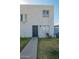 Exterior view of a two-story apartment building with a small front yard and a walkway at 7506 N 47Th Dr, Glendale, AZ 85301
