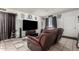 Comfortable living room setup with a large TV and a relaxing recliner sofa at 7506 N 47Th Dr, Glendale, AZ 85301