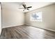 Spacious bedroom with hardwood flooring and a large window at 7920 E Camelback Rd # 110, Scottsdale, AZ 85251