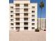 View of the building's exterior featuring private balconies and desert landscaping at 7920 E Camelback Rd # 110, Scottsdale, AZ 85251